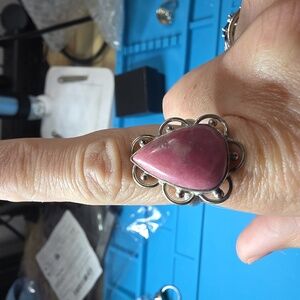 This vintage sterling silver ring features a teardrop-shaped pink rhodonite gems